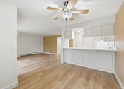 Thumbnail 84 of 133 - A room with a ceiling fan and wooden flooring.