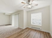 Thumbnail 126 of 133 - A room with a ceiling fan and a window with blinds.
