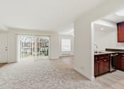 Thumbnail 113 of 133 - A white interior of a house with a kitchen area.