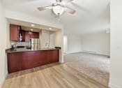 Thumbnail 121 of 133 - A kitchen with a brown counter and a ceiling fan.