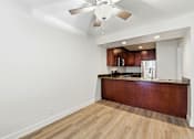 Thumbnail 129 of 133 - A kitchen with a wooden counter and a ceiling fan.