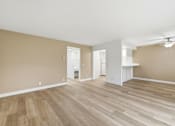 Thumbnail 81 of 133 - A room with wooden flooring and white walls.