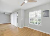 Thumbnail 73 of 133 - A room with a ceiling fan and a window with blinds.