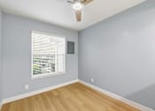 Thumbnail 72 of 133 - A room with a ceiling fan and a window with blinds.