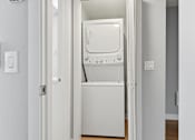 Thumbnail 53 of 133 - A white dryer is sitting in a doorway.