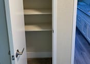 Thumbnail 25 of 43 - A white door with a silver handle is open.