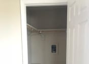 Thumbnail 10 of 31 - an empty closet with a white door
