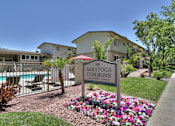 Thumbnail 1 of 51 - A sign for SARATOGA COMMONS in front of a pool.