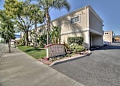 Thumbnail 1 of 33 - A street view of a residential area with a sign that reads