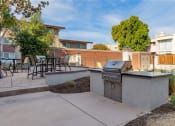 Thumbnail 28 of 37 - a backyard with a barbecue grill and a patio with tables and chairs