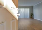 Thumbnail 10 of 35 - A room with a window covered by white blinds and a potted plant.
