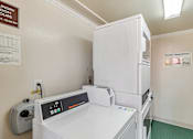 Thumbnail 42 of 43 - A laundry room with a washing machine