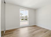 Thumbnail 50 of 92 - A room with a window overlooking a cityscape.