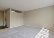 Thumbnail 23 of 33 - the living room and dining room of an empty house