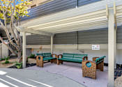 Thumbnail 40 of 43 - A small covered seating area with a no smoking sign.