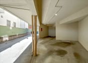 Thumbnail 14 of 36 - a large empty room in a building with a street