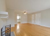 Thumbnail 32 of 37 - A room with wooden floors and white walls.