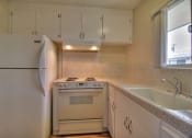 Thumbnail 5 of 16 - Kitchen With White Cabinetry And Appliances at Ranchero Plaza, San Jose, CA, 95117