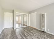Thumbnail 38 of 42 - A room with a white door and a white wall with a window.