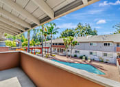 Thumbnail 32 of 52 - A pool is in the middle of a patio.