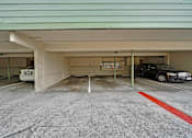Thumbnail 16 of 16 - A parking garage with a red line painted on the ground.