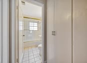 Thumbnail 21 of 21 - A white bathroom with a toilet and a shower.