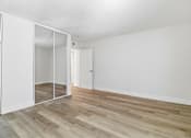 Thumbnail 44 of 92 - A room with a white door and a white wall.