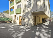 Thumbnail 10 of 36 - the building has a long driveway and a parking garage