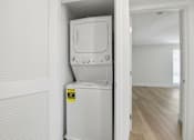 Thumbnail 57 of 92 - A white fridge with a yellow sticker on it.