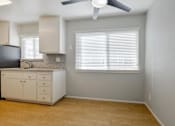 Thumbnail 12 of 29 - a kitchen with a counter top and a window