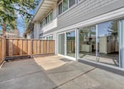 Thumbnail 47 of 53 - a patio in front of a white unit with glass doors
