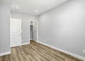 Thumbnail 60 of 60 - A room with a white door and a white wall.