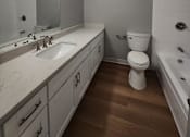 Thumbnail 50 of 51 - an empty bathroom with a toilet and a sink