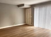 Thumbnail 40 of 51 - the living room and dining room of an apartment with wood flooring