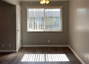 Thumbnail 35 of 37 - A room with a ceiling fan and a window with blinds.