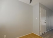 Thumbnail 10 of 29 - a room with white walls and a closet and a door