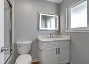 Thumbnail 53 of 53 - a bathroom with a sink toilet and a mirror