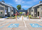 Thumbnail 41 of 41 - A parking lot with two handicap parking spaces in the foreground.
