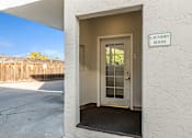 Thumbnail 25 of 42 - A laundry room sign is on a white wall.