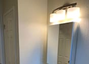 Thumbnail 32 of 32 - a bathroom with a sink and a mirror