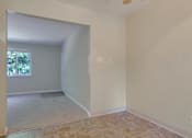 Thumbnail 25 of 34 - A room with a tiled floor and a window.