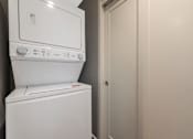 Thumbnail 54 of 62 - A white dishwasher is in a room with a white door.