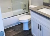 Thumbnail 7 of 7 - a bathroom with a toilet and a shower