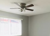 Thumbnail 6 of 7 - an empty room with a ceiling fan and a window