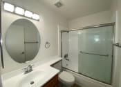 Thumbnail 9 of 26 - a bathroom with a sink toilet and a shower