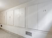 Thumbnail 31 of 32 - A row of white lockers numbered 7, 8, 9, and 10.