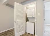 Thumbnail 19 of 27 - A white refrigerator is in a small room with a door open.