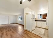 Thumbnail 21 of 43 - A kitchen with white cabinets and a refrigerator.