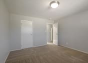 Thumbnail 7 of 29 - a living room with a hard wood floor and white walls