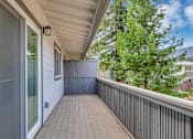 Thumbnail 17 of 53 - a long porch with a wood floor and a large glass door